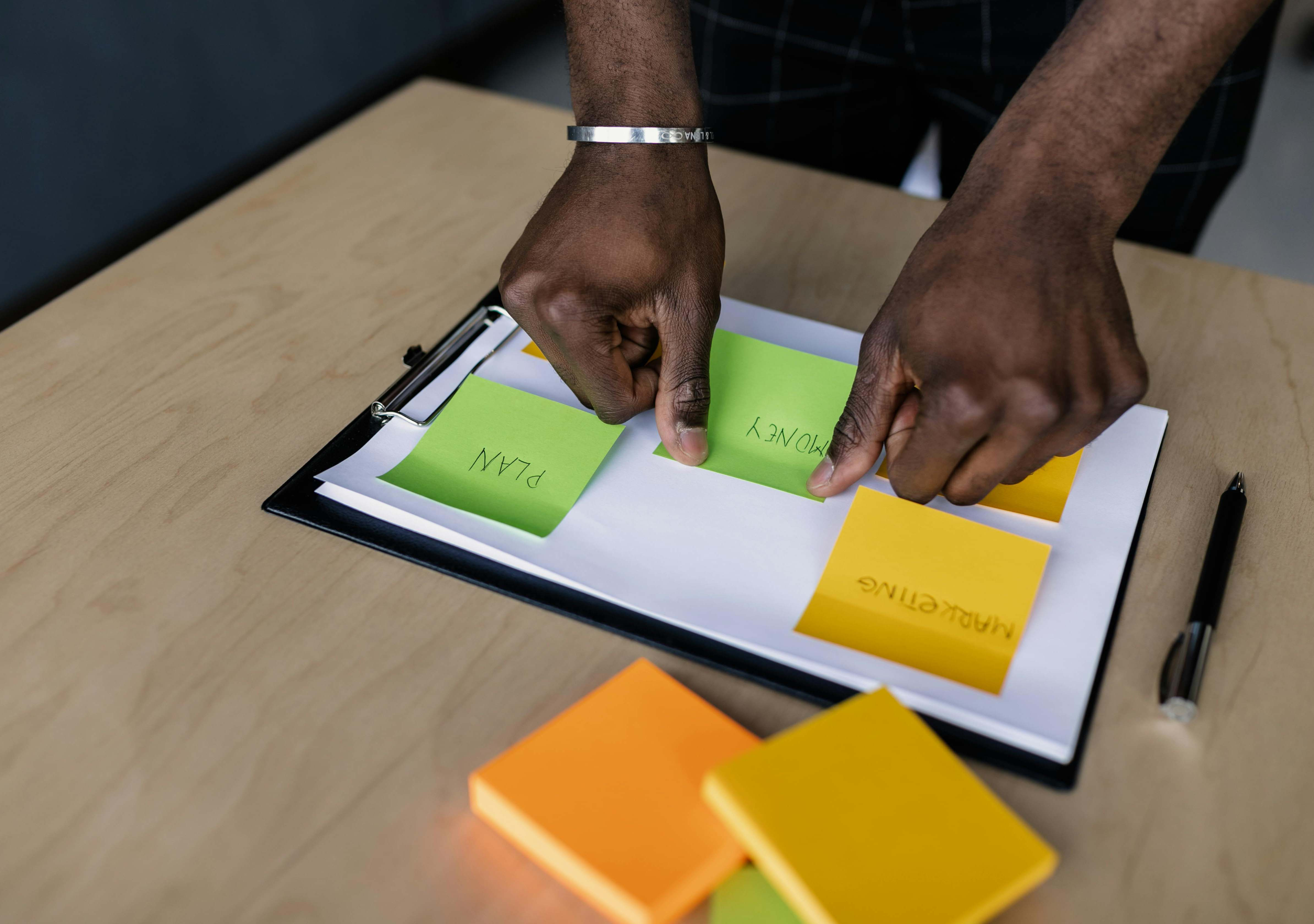 "Team reviewing property plans, symbolizing professional property management logo design for trust and brand recognition."